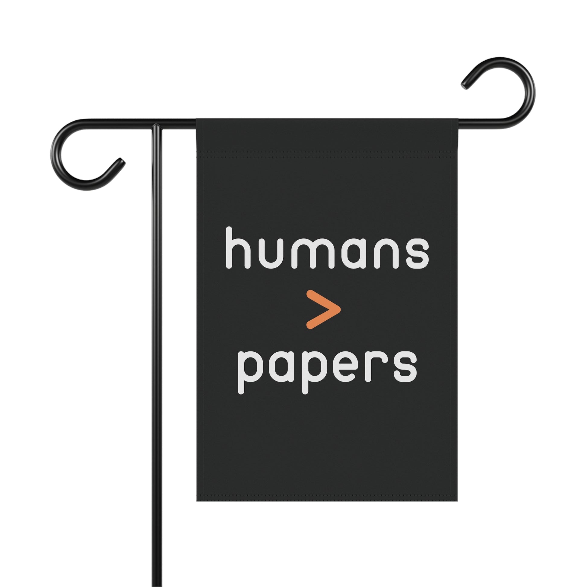 Black garden flag with 'humans > papers' white text
