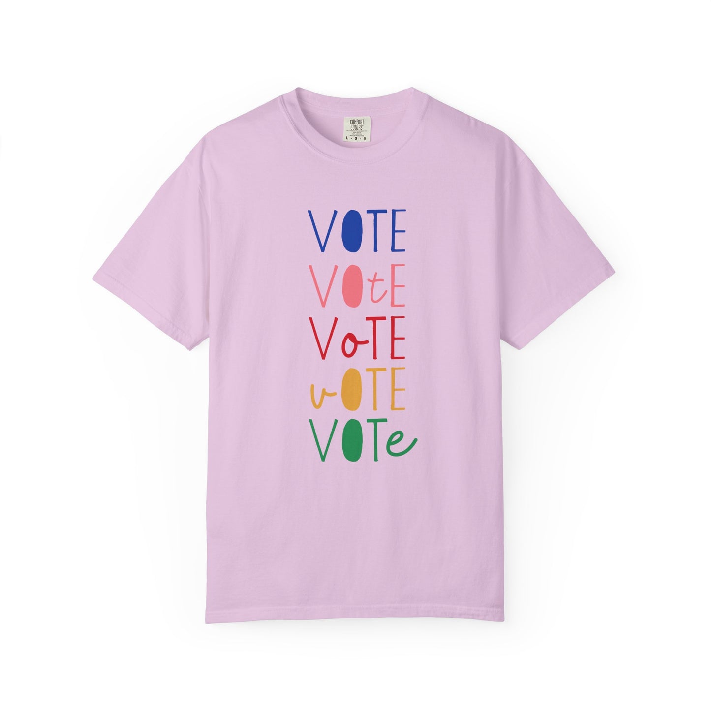 A light purple short-sleeve t-shirt with a vertical graphic spelling 'VOTE' in alternating blue, pink, red, yellow, and green colors, displayed on a clean white background.