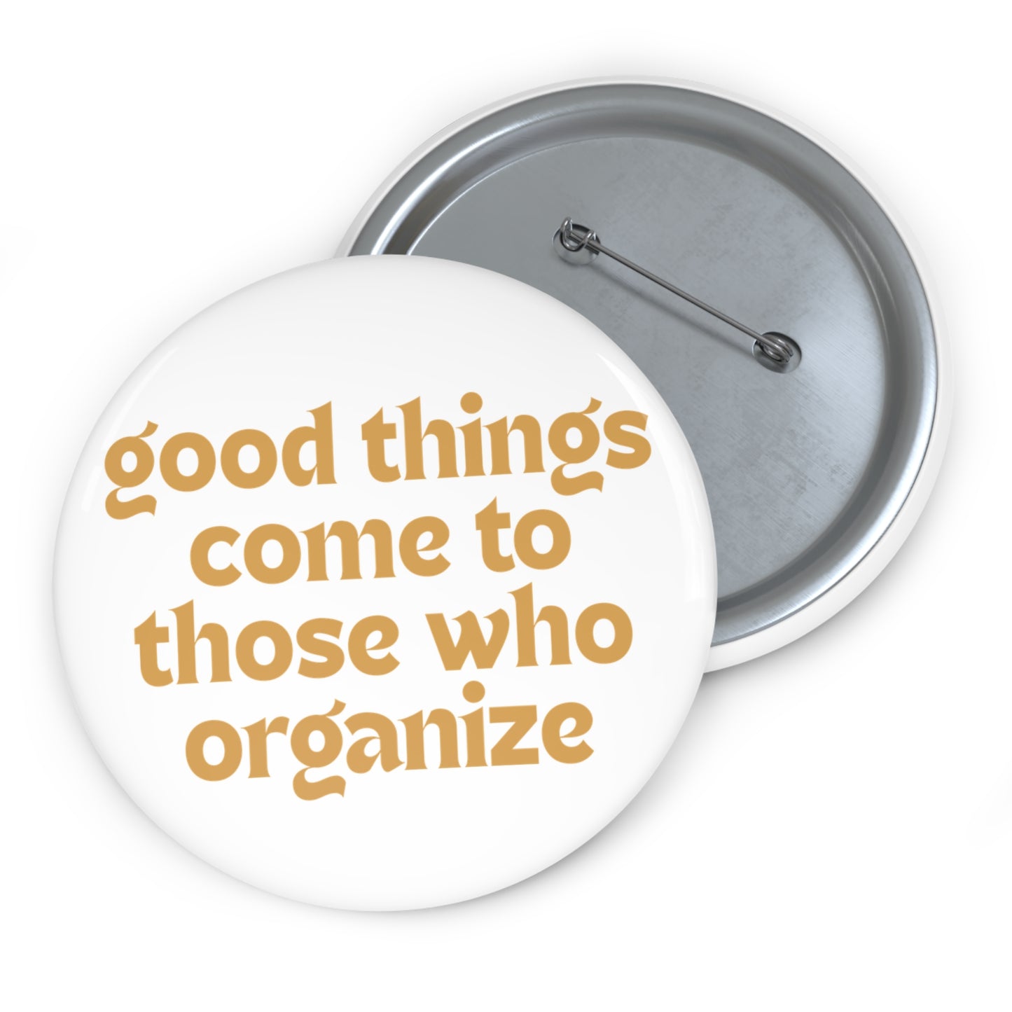 White pin button with 'good things come to those who organize' gold text