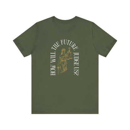 Military green t-shirt with sketch of lady justice and words in white arched around it "how will the future judge us?" 