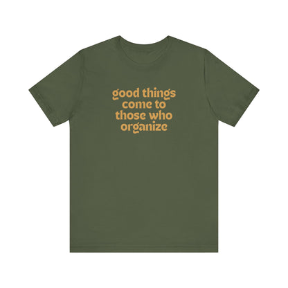Military green t-shirt with gold text 'good things come to those who organize'