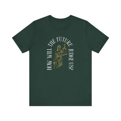 Forest green t-shirt with sketch of lady justice and words in white arched around it "how will the future judge us?" 