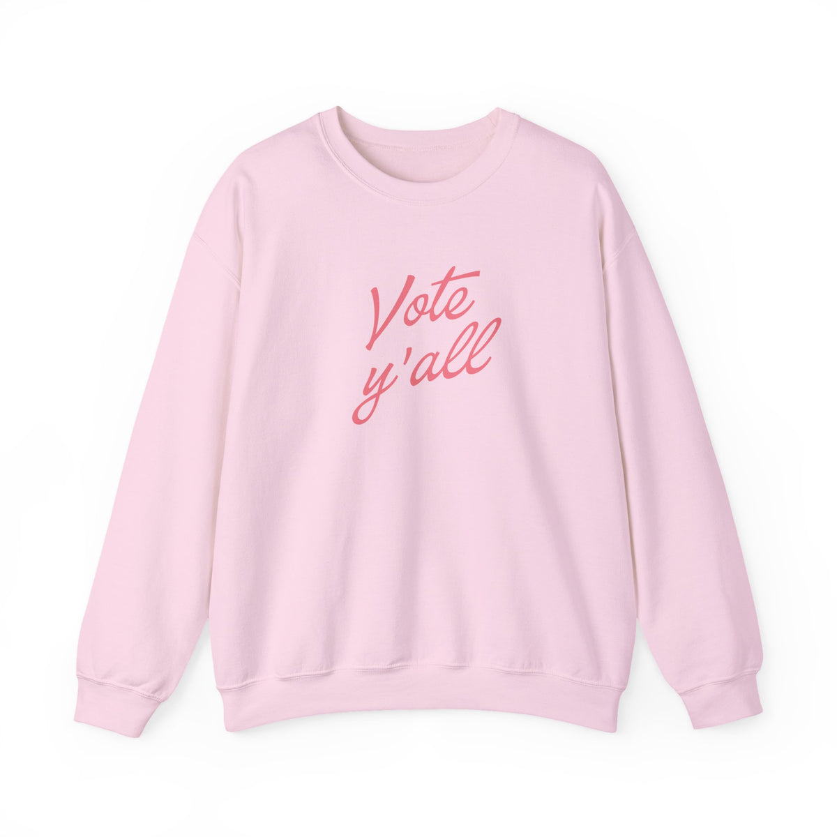 A light pink crewneck sweatshirt with the phrase 'Vote y'all' printed in a pink cursive font across the chest, displayed on a clean white background.