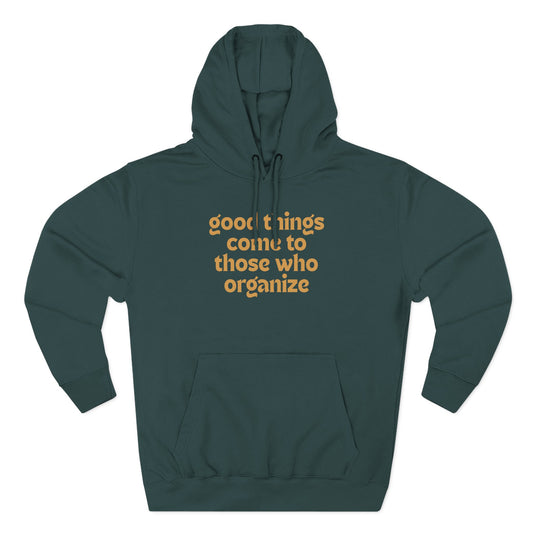 Green hoodie with gold text "good things come to those who organize"