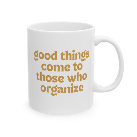 White ceramic 11 oz coffee or tea mug with 'good things come to those who organize' gold text