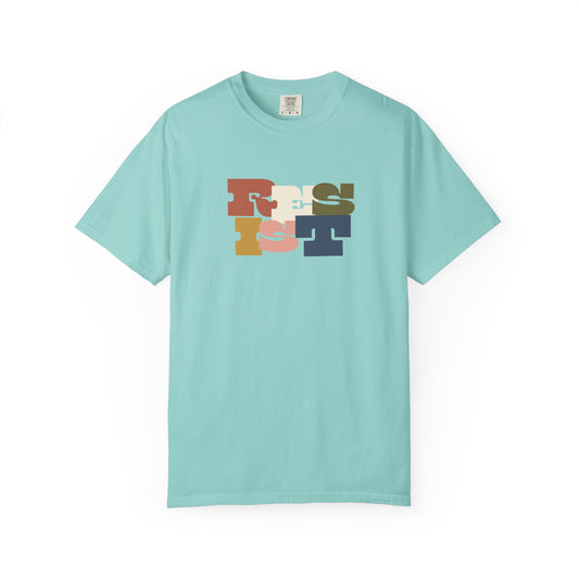 Light blue t-shirt with colorful "RESIST" text design