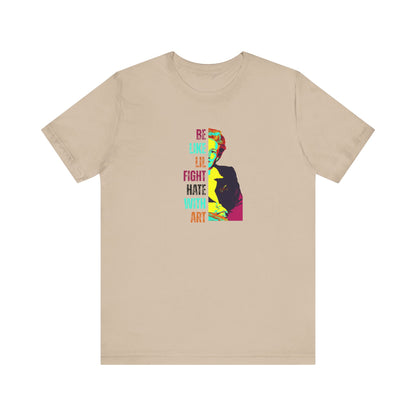 Beige t-shirt with colorful illustration of Lillian Smith and text "be like lil, fight hate with art"
