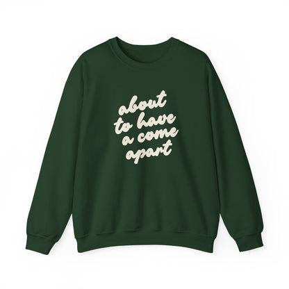 Dark green sweatshirt with "about to have a come apart" in cream text