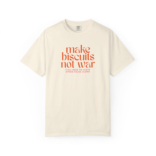 Beige t-shirt with orange text 'make biscuits not war' with smaller pink text "y'all need to leave other folks alone" 
