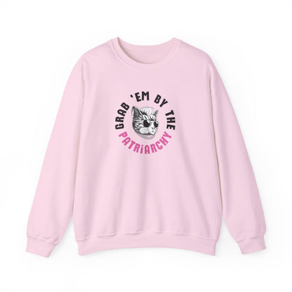 Light pink sweatshirt with punk rock cat graphic design and black and pink text "grab 'em by the patriarchy"