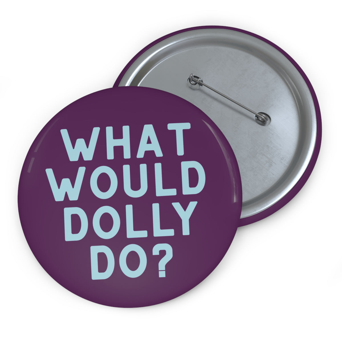 Two round pinback buttons on a white background. The front button is purple with the text 'WHAT WOULD DOLLY DO?' in light blue.