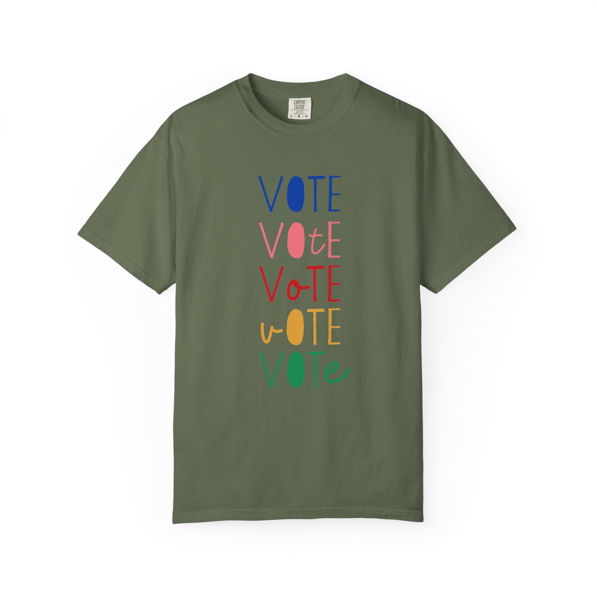 A military green short-sleeve t-shirt with a vertical graphic spelling 'VOTE' in alternating blue, pink, red, yellow, and green colors, displayed on a clean white background.