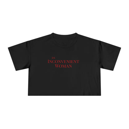 Black t-shirt with 'An Inconvenient Woman' text in red 