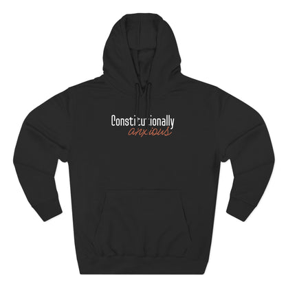 Black hoodie with 'Constitutionally Anxious' text in orange and white