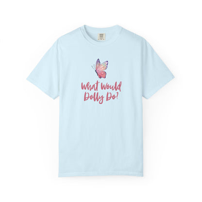 A light blue short-sleeve t-shirt with a graphic of a pink and purple butterfly above the pink cursive text 'What Would Dolly Do!' on the chest, displayed on a clean white background.