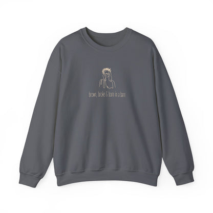 Gray unisex crewneck sweatshirt with a sketch graphic of Jesus and "brown, broke & born in a barn" cream text