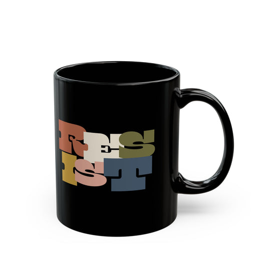 Black 11 oz mug with colorful text "RESIST"