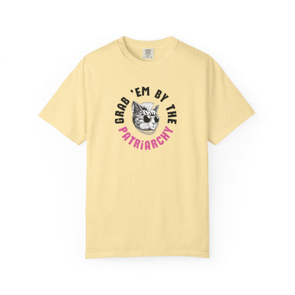 Yellow t-shirt with punk rock cat graphic design and black and pink text "grab 'em by the patriarchy"