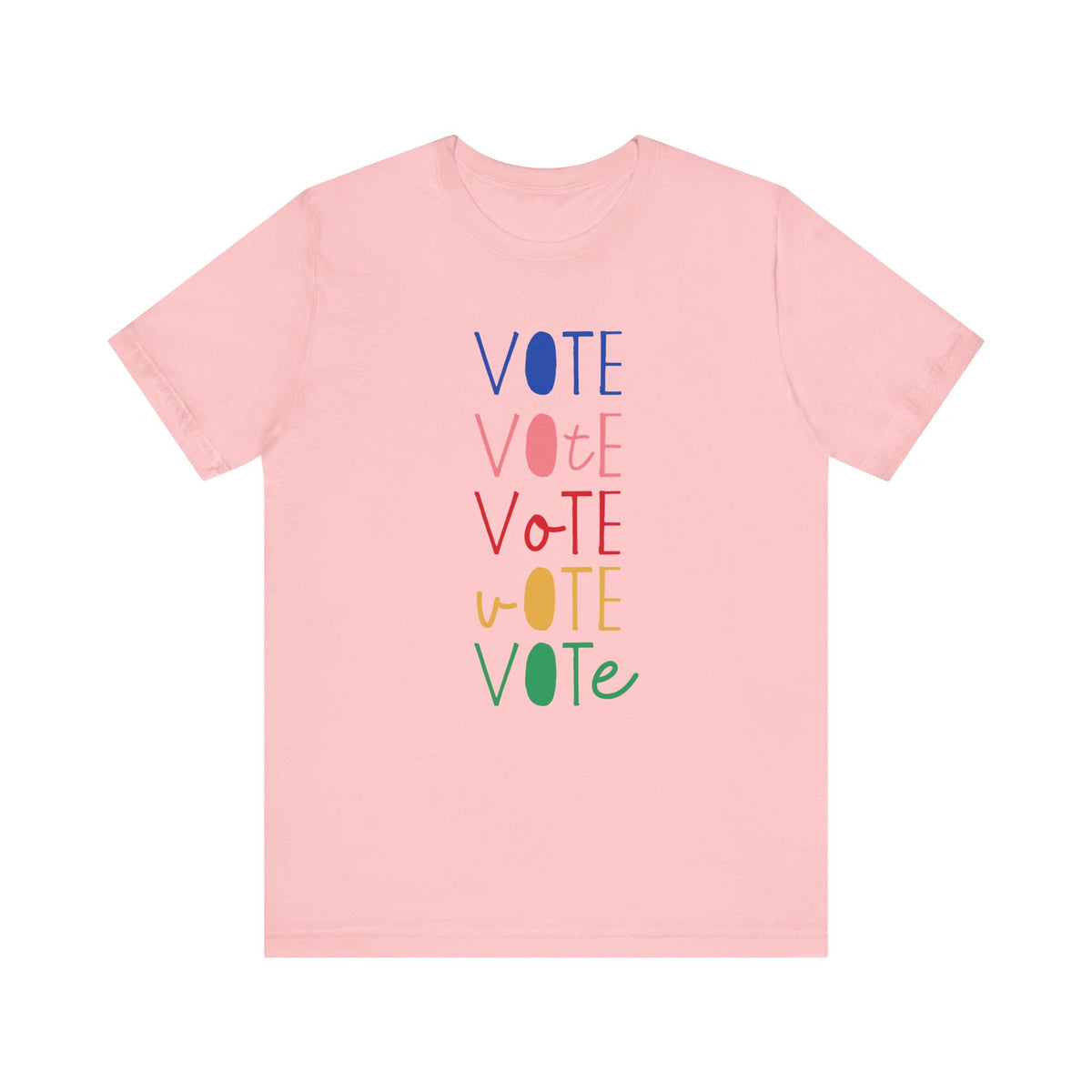 A light pink short-sleeve t-shirt with a vertical graphic on the chest spelling 'VOTE' in alternating bright colors (blue, pink, red, yellow, green) with oval letterforms, shown on a plain white background.