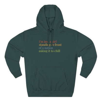 Teal hoodie with colorful text "i'm just a girl standing in front of a nation asking it to chill"