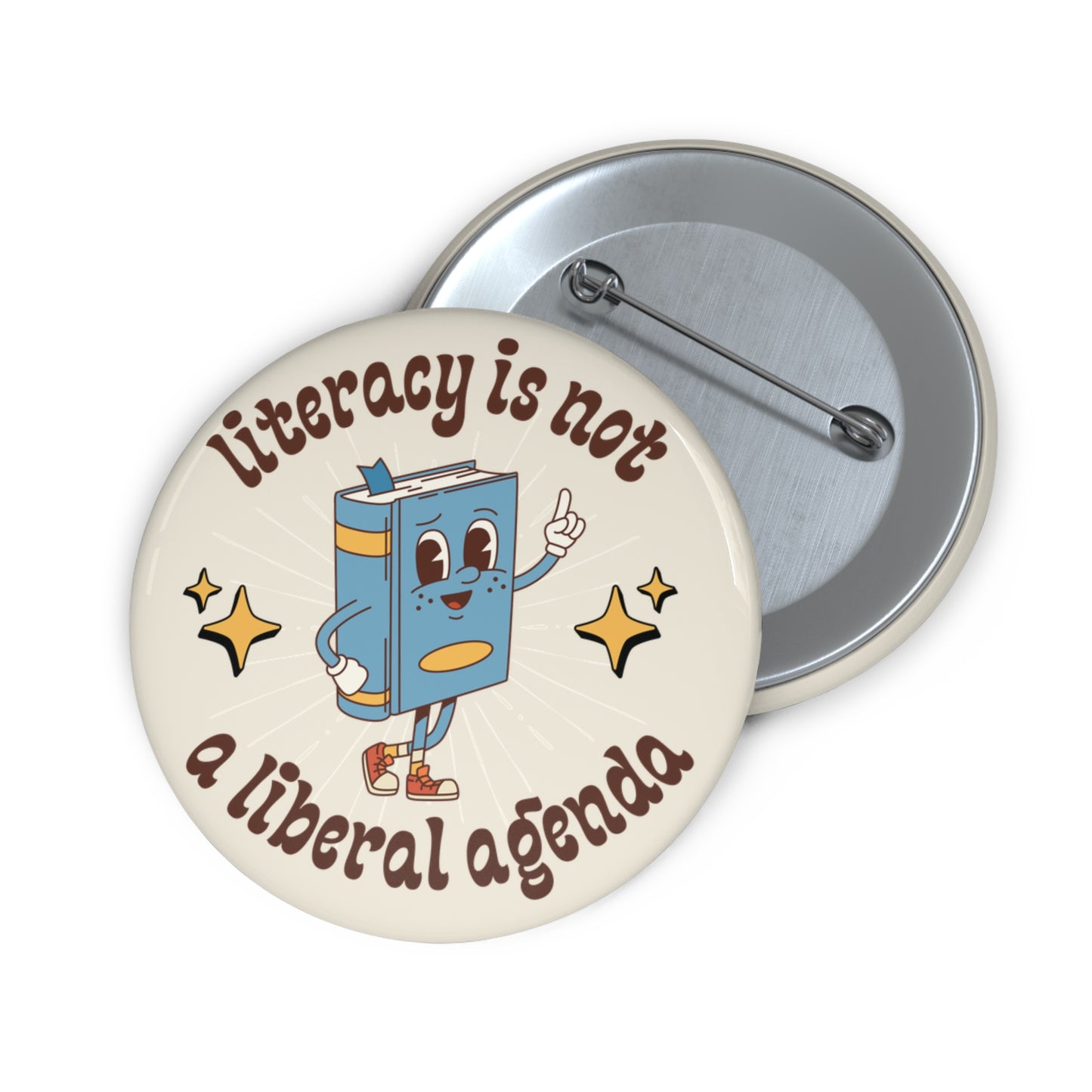 Cream pin button with book character  graphic and text 'Literacy is not a liberal agenda' 