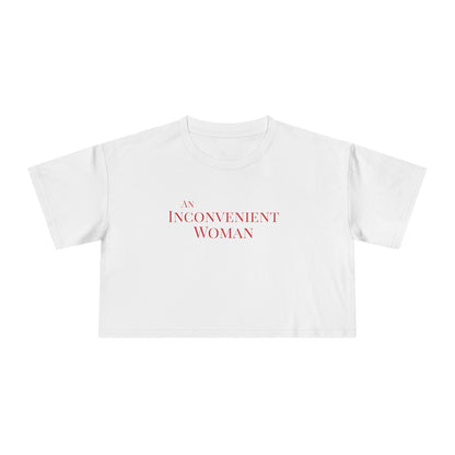 White t-shirt with 'An Inconvenient Woman' text in red 