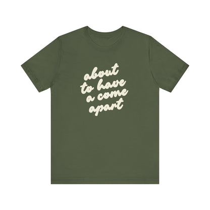 Green t-shirt with cream words "about to have a come apart"