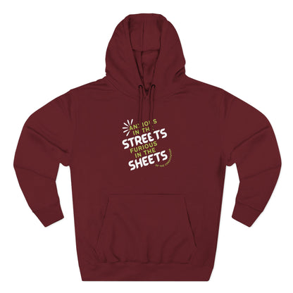 Maroon hoodie with "anxious in the streets furious in the sheets of the constitution" green and white text