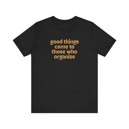 Black t-shirt with gold text 'good things come to those who organize'
