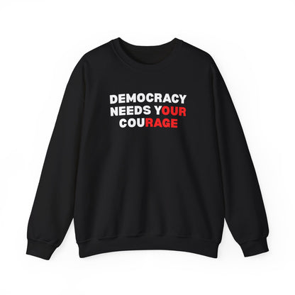 Black unisex crewneck sweatshirt with 'Democracy Needs Your Courage' white and red text