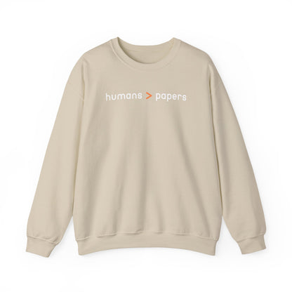 Tan unisex crewneck sweatshirt with 'humans > papers' white text