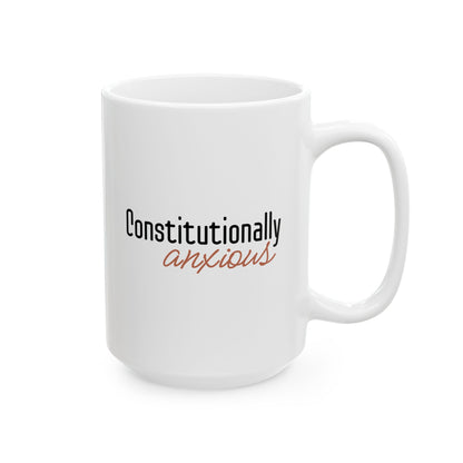 White 15 oz mug with 'Constitutionally anxious' text in black and orange