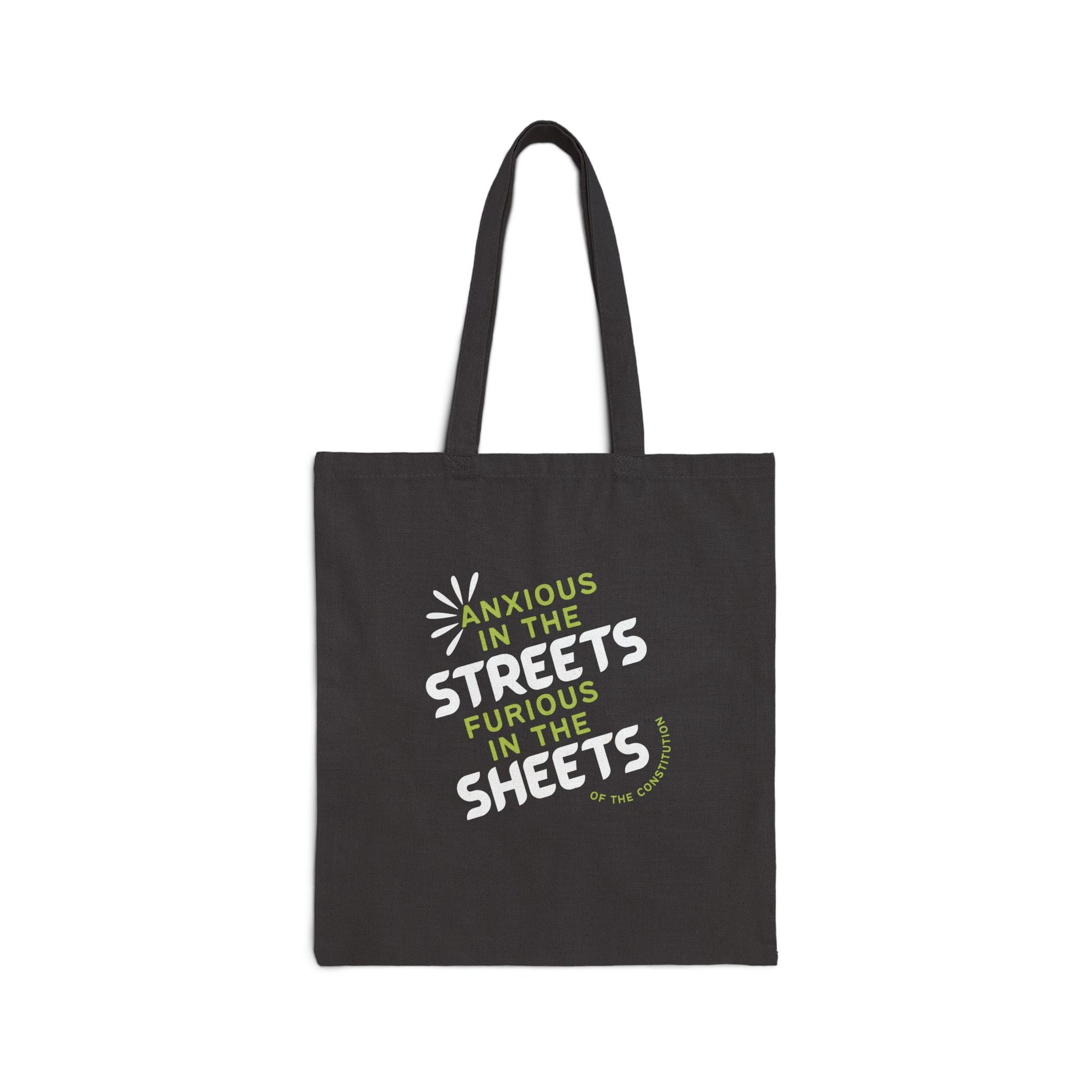 Black canvas tote bag with "anxious in the streets, furious in the sheets (of the constitution)" lime green and white text