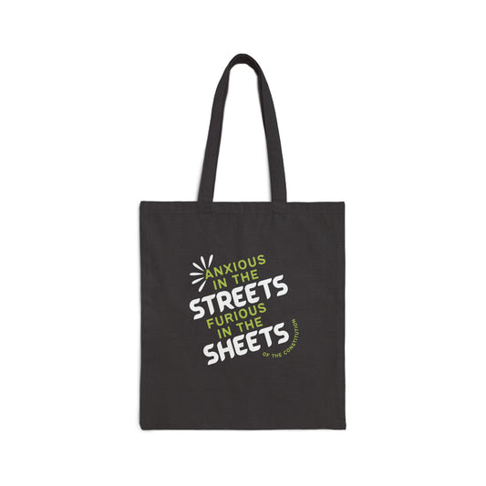 Black canvas tote bag with "anxious in the streets, furious in the sheets (of the constitution)" lime green and white text