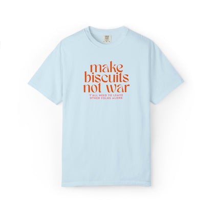 Light blue t-shirt with orange text 'make biscuits not war' with smaller pink text "y'all need to leave other folks alone" 