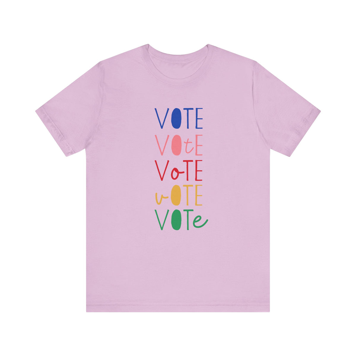 A light purple short-sleeve t-shirt with a vertical graphic on the chest spelling 'VOTE' in alternating bright colors (blue, pink, red, yellow, green) with oval letterforms, shown on a plain white background.