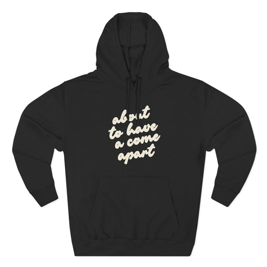Black hoodie with "about to have a come apart" in cream text