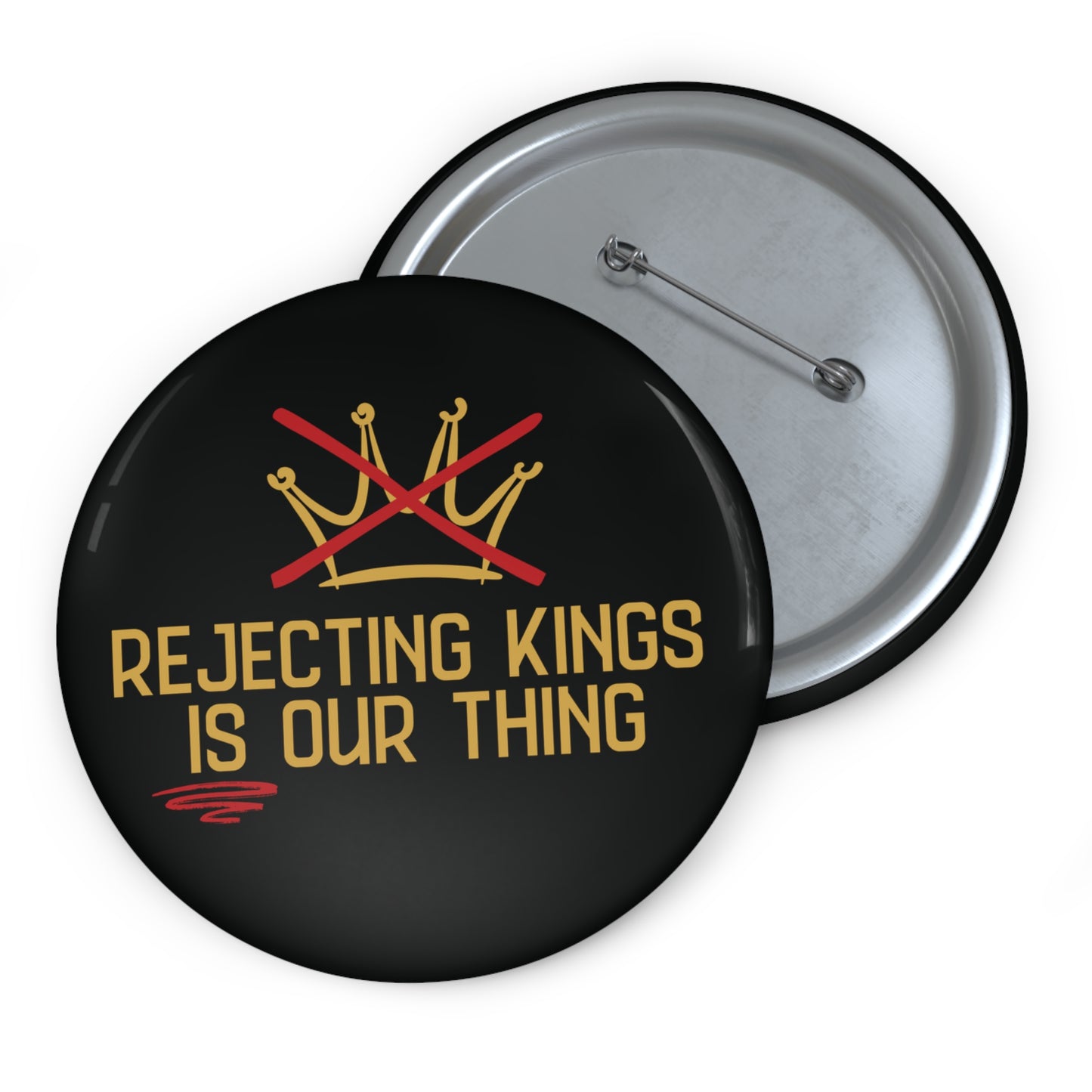 Button with 'Rejecting Kings is Our Thing' text and crossed crowns design on a black background.