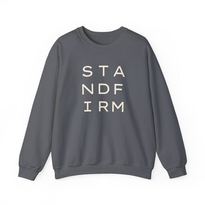 Gray unisex crewneck sweatshirt with 'STAND FIRM' cream text 