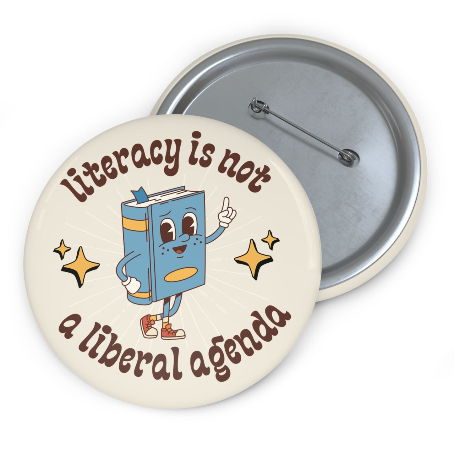 Cream pin button with book character  graphic and text 'Literacy is not a liberal agenda' 