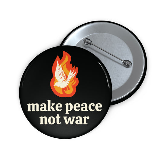 Black button with 'make peace not war' cream text and white dove over orange flame design 