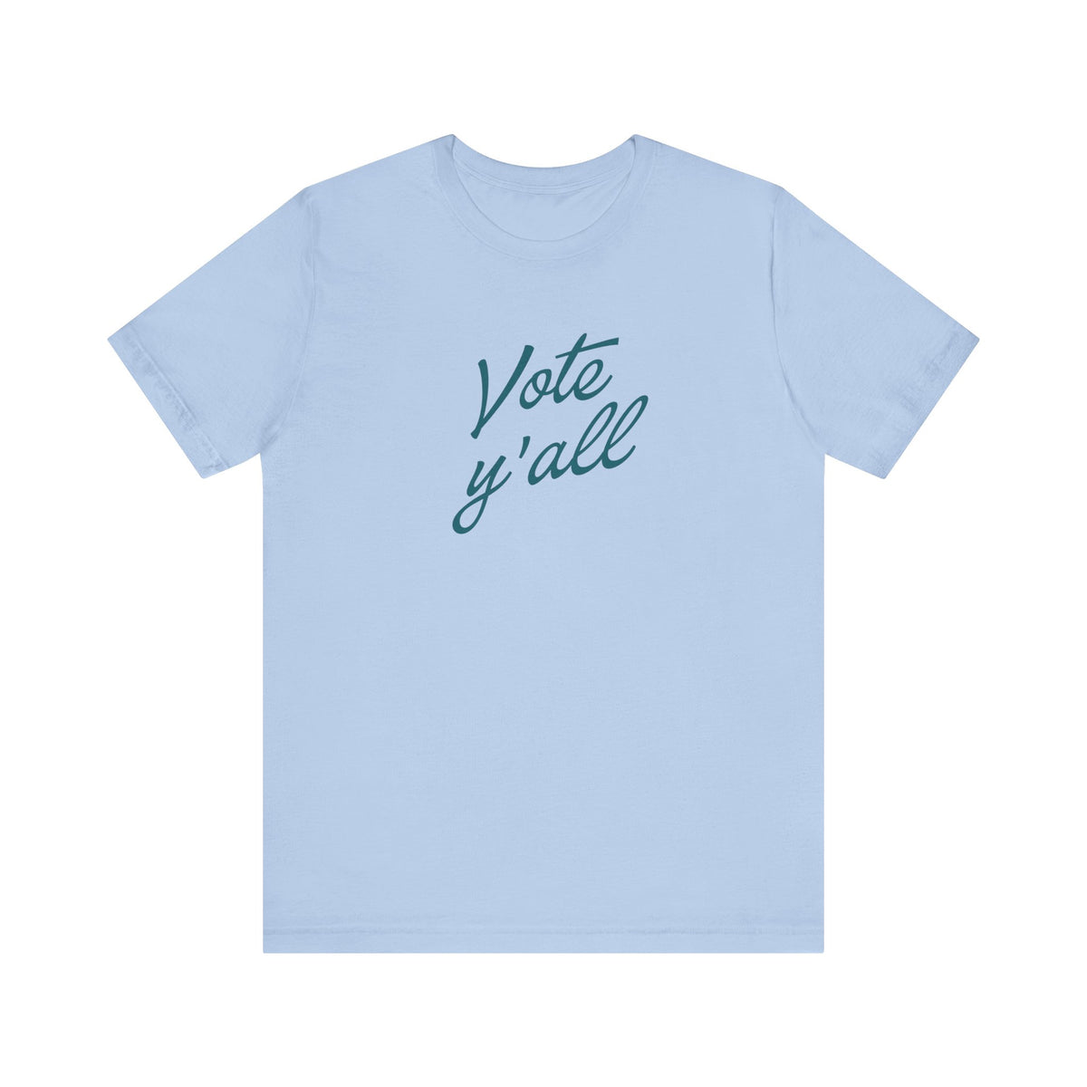 A light blue short-sleeve crewneck t-shirt featuring the phrase 'Vote y'all' printed in a dark teal cursive font across the chest, displayed on a clean white background.