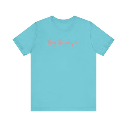 Turquoise t-shirt with 'they the people' text in pink