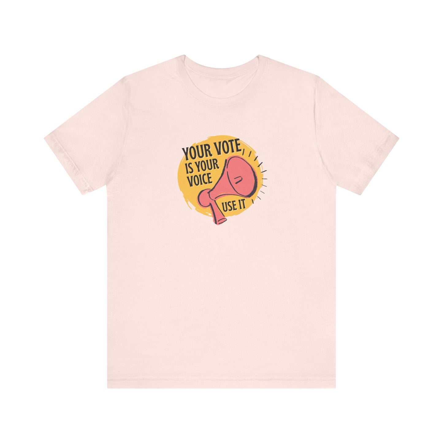 Light pink t-shirt with a coral megaphone graphic over bright yellow circle and black text "your vote is your voice, use it" 
