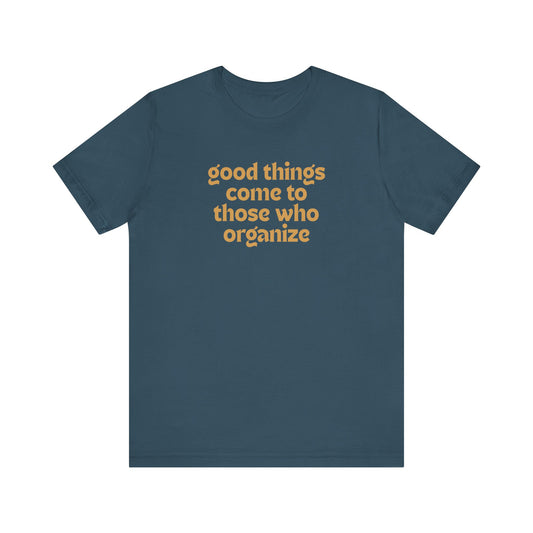 Dark blue t-shirt with gold text 'good things come to those who organize'