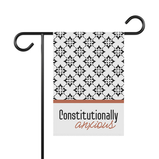 Decorative garden flag with black and white pattern and 'Constitutionally anxious' text on a white background.