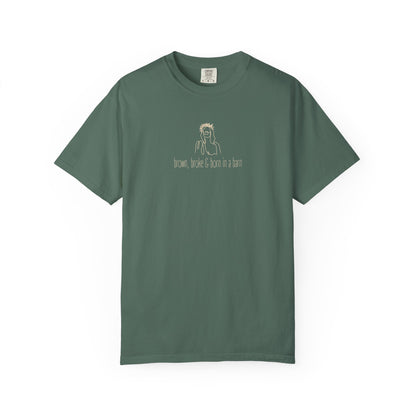 Green unisex Comfort Colors t-shirt with Jesus sketch graphic and "brown, broke & born in a barn" in cream text