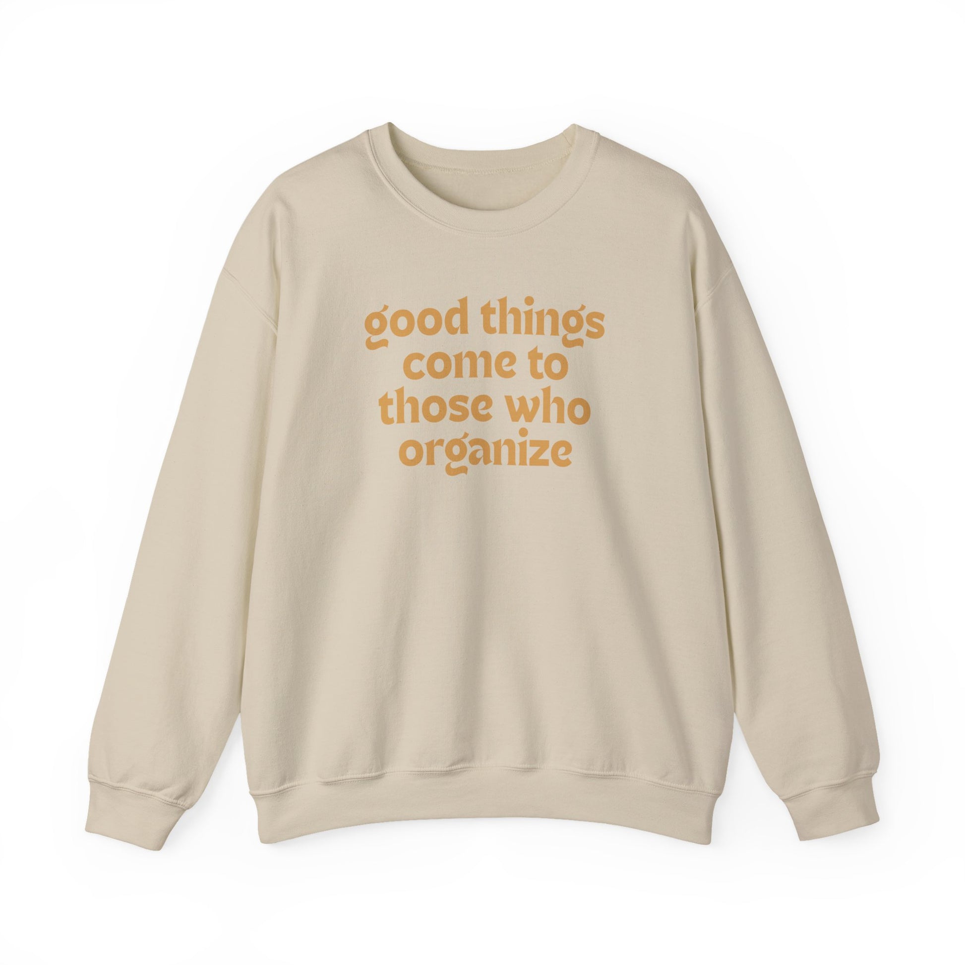 Tan unisex crewneck sweatshirt with 'good things come to those who organize' gold text