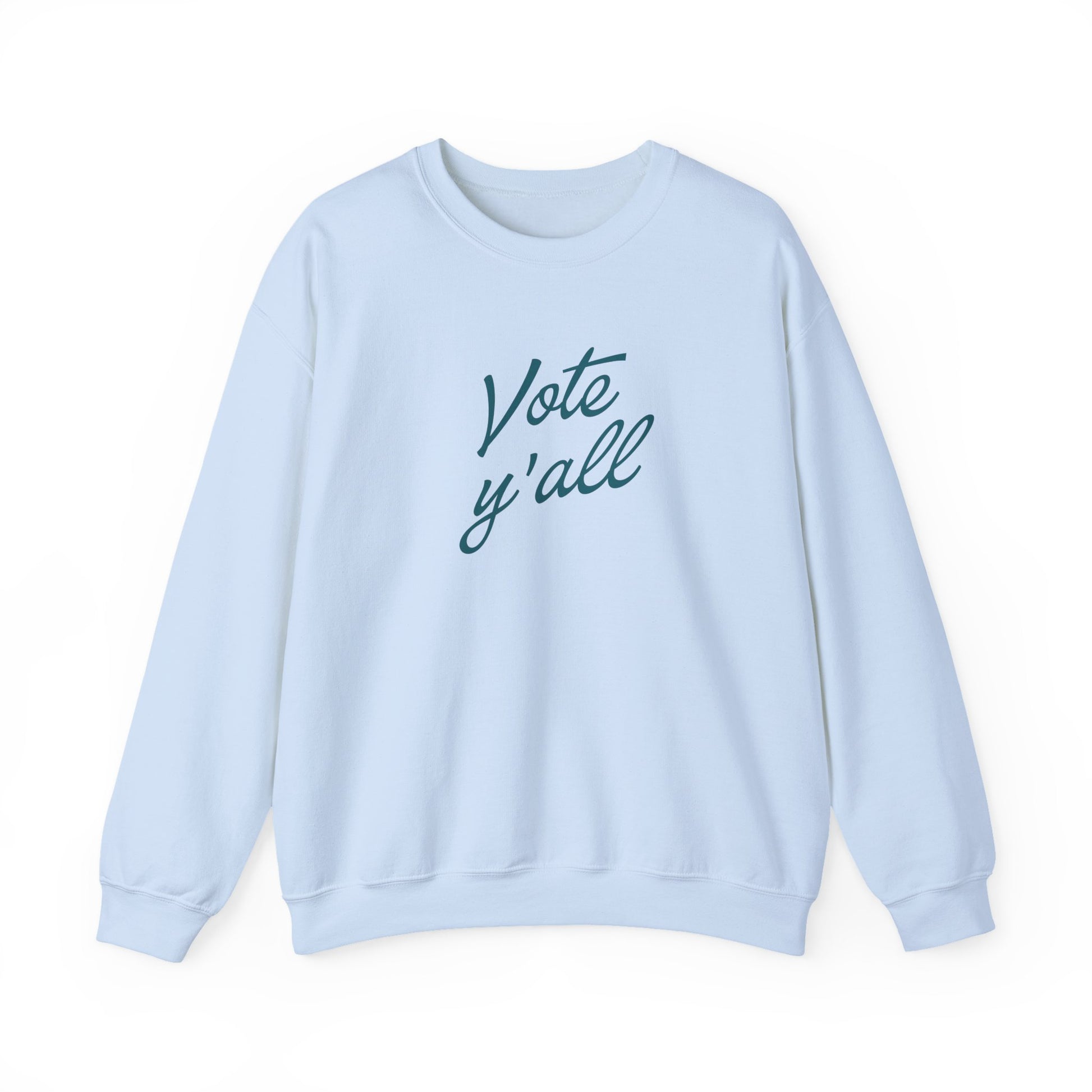 A light blue crewneck sweatshirt with the words 'Vote y'all' printed in a dark blue cursive font on the chest