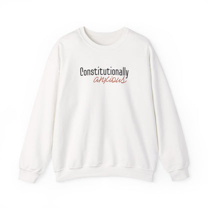 White sweatshirt with 'Constitutionally Anxious' text in black and orange